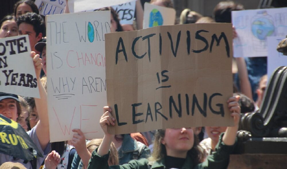 Activism is learning protest sign